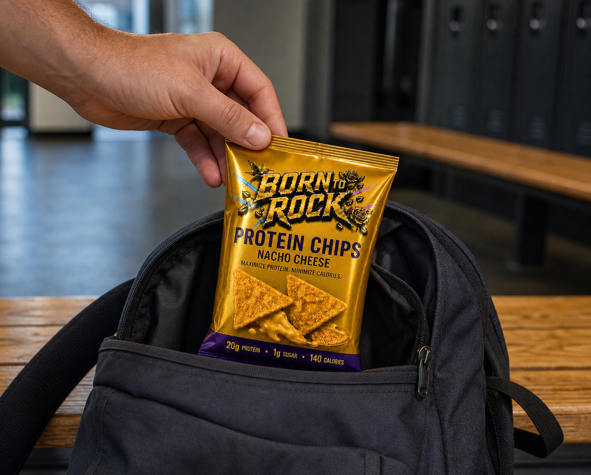 A hand lifting the bag out of an open backpack on a changing bench at the gym