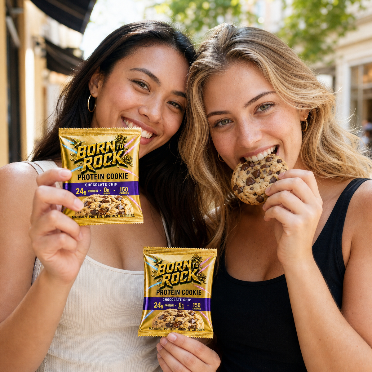 Two friends enjoying the cookie on a city sidewalk