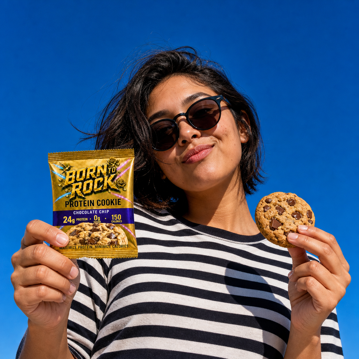 Bold outdoor portrait holding the pack against a blue sky
